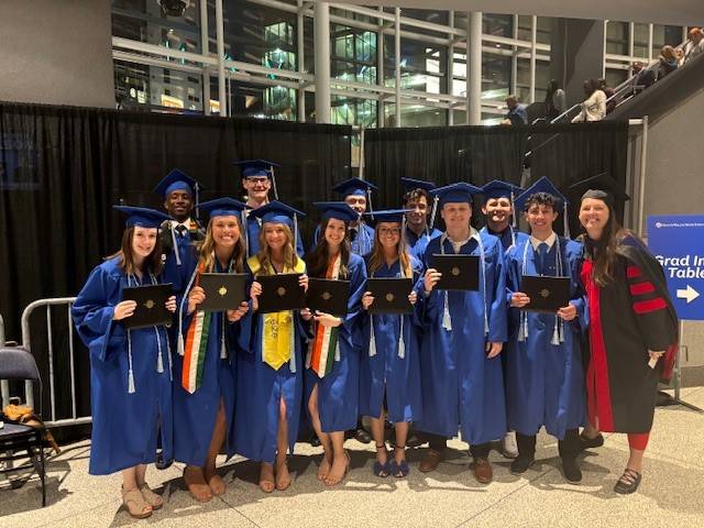 Some of our 2023 grads pose for a group photo! Say Cheese!